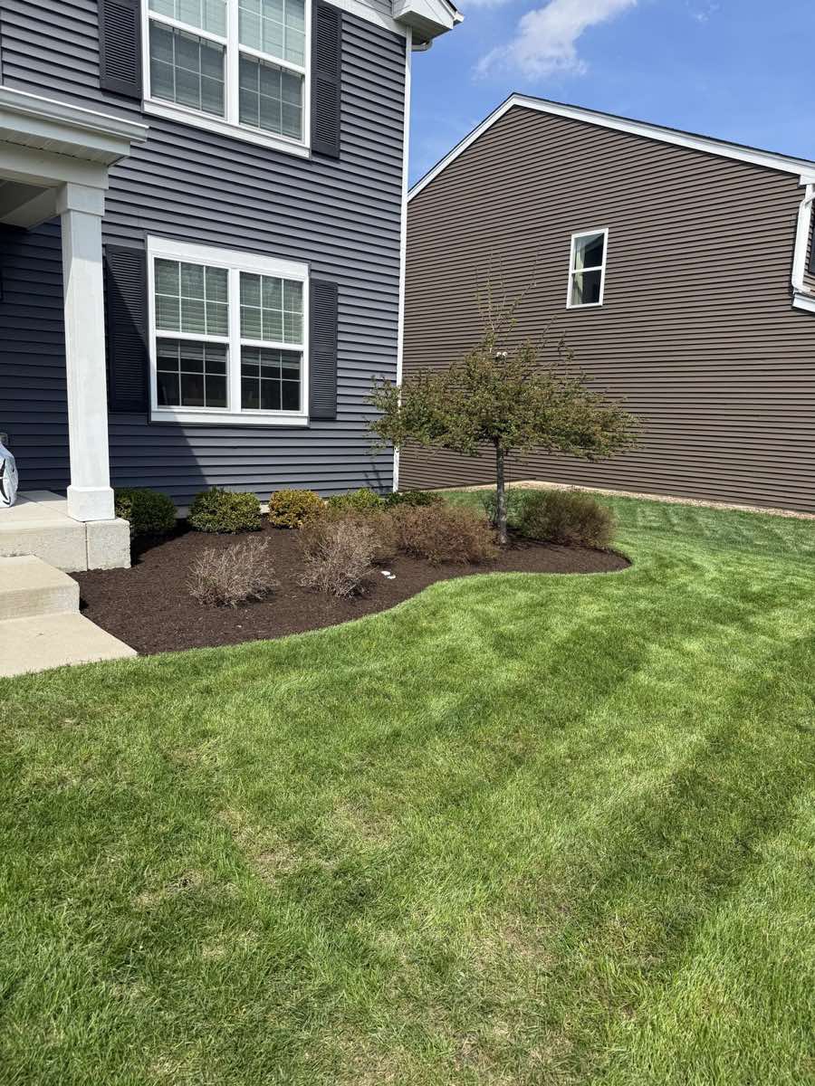 Brown mulch bed installation